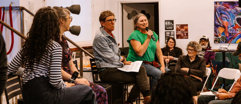 Photo of fours panelists at a community workshop