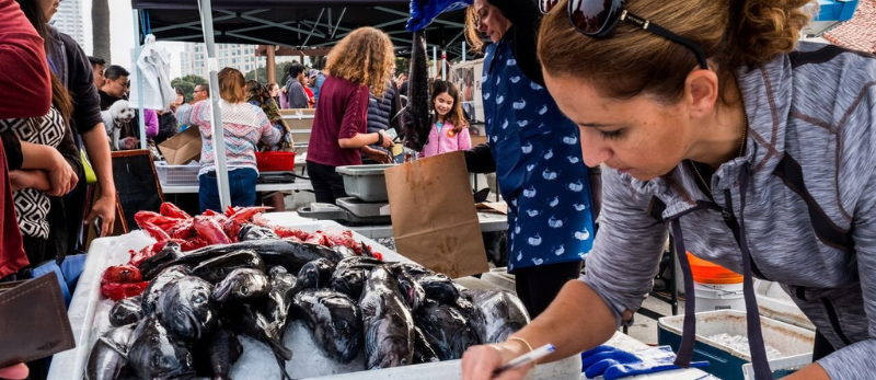 People working at seafood stall