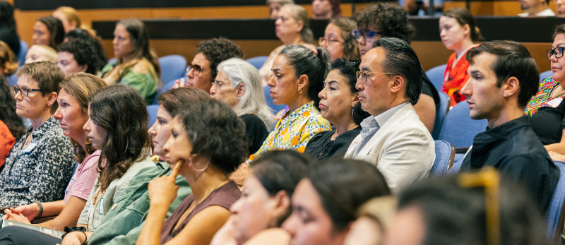 People seated in auditorium